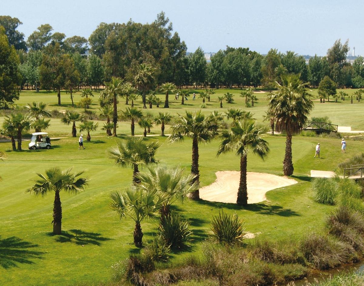 Palm-lined fairways and bunkers at Isla Canela